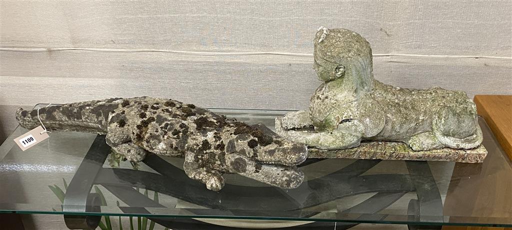 Two reconstituted stone garden ornaments, one of a crocodile, 76cm long the other a sphinx, 48cm long